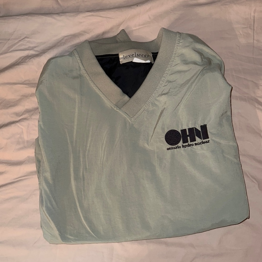 Greyish green light weight wind breaker